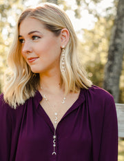 Ashley Childers Celeste Statement Necklace in Gold with star and moon design